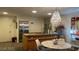 Modern kitchen with stainless steel appliances and a chandelier above the dining table at 3722 Las Vegas Blvd # 1205, Las Vegas, NV 89158