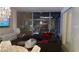Living room featuring floor-to-ceiling windows that showcase city views at night at 3722 Las Vegas Blvd # 1205, Las Vegas, NV 89158