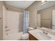 Bathroom with a shower-tub combo, toilet, and vanity at 3736 Paseo De Paz Ave, Las Vegas, NV 89115