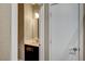 The modern bathroom has a floating vanity with mirror and is located next to a door at 3736 Paseo De Paz Ave, Las Vegas, NV 89115