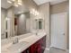 Modern bathroom with double sinks, sleek vanity, quartz countertops, and contemporary lighting at 3736 Paseo De Paz Ave, Las Vegas, NV 89115