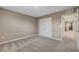 Carpeted bedroom featuring a closet and a view of the hallway at 3736 Paseo De Paz Ave, Las Vegas, NV 89115