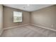 Bright bedroom with carpet, neutral walls, and natural light from the window at 3736 Paseo De Paz Ave, Las Vegas, NV 89115