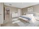 Cozy bedroom with white furniture, soft carpet, and ample natural light at 3736 Paseo De Paz Ave, Las Vegas, NV 89115