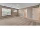 Spacious bedroom with neutral tones, carpet, and natural light from the window at 3736 Paseo De Paz Ave, Las Vegas, NV 89115