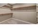 Spacious walk-in closet with multiple levels of shelving for ample storage space at 3736 Paseo De Paz Ave, Las Vegas, NV 89115