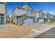 Contemporary two-story home with a two-car garage, complemented by low-maintenance desert landscaping at 3736 Paseo De Paz Ave, Las Vegas, NV 89115