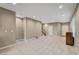 Spacious living room with tile flooring, neutral walls, recessed lighting, and stairs to the second floor at 3736 Paseo De Paz Ave, Las Vegas, NV 89115