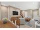 Comfortable living room and dining area enhanced by neutral colors and bright lighting at 3736 Paseo De Paz Ave, Las Vegas, NV 89115