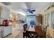 Bright dining area with a large wooden table, built-in cabinets, and sliding glass doors, ideal for Gathering meals at 405 Longtree Ave, Henderson, NV 89011