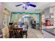 Open dining area with a large wooden table, connecting to the living room and kitchen for easy entertaining at 405 Longtree Ave, Henderson, NV 89011