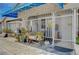 Close-up of the gated front yard with charming plants and a covered entryway, creating a welcoming curb appeal at 405 Longtree Ave, Henderson, NV 89011