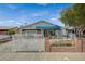 Inviting single-story home with a gated front yard, covered entry, and a well-maintained exterior at 405 Longtree Ave, Henderson, NV 89011