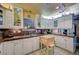 Bright kitchen with custom cabinetry, granite countertops, and an island for extra workspace at 405 Longtree Ave, Henderson, NV 89011