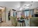 Comfortable living room with patterned furniture, tile floors, and decorative lighting fixtures, creating a welcoming space at 405 Longtree Ave, Henderson, NV 89011