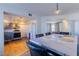 Open dining area with marble counter top, view of kitchen, and bright lighting at 436 Emden St, Henderson, NV 89015