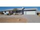 Single story home with blue siding, gravel driveway, and well-maintained front yard at 436 Emden St, Henderson, NV 89015