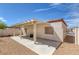 Wide view of a covered patio with desert landscaping at 4828 Marco Polo St, North Las Vegas, NV 89031