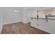 Bright dining room featuring wood-style flooring and easy access to kitchen at 4828 Marco Polo St, North Las Vegas, NV 89031