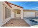 Single-story home with low maintenance rock landscaping, a covered entry, and an attached two-car garage at 4828 Marco Polo St, North Las Vegas, NV 89031