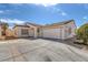 Inviting single-story home featuring stucco siding, a two-car garage, and low-maintenance landscaping at 4828 Marco Polo St, North Las Vegas, NV 89031