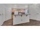 Bright, open-concept kitchen with bar seating, plenty of cabinet space, and modern appliances at 4828 Marco Polo St, North Las Vegas, NV 89031