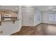 Open-concept design connecting the kitchen to the living room, with modern flooring and natural light at 4828 Marco Polo St, North Las Vegas, NV 89031
