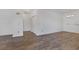 Spacious living room with wood-style flooring, neutral walls, and natural light at 4828 Marco Polo St, North Las Vegas, NV 89031