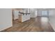 Open floorplan with kitchen featuring breakfast bar and wood-style flooring at 4828 Marco Polo St, North Las Vegas, NV 89031