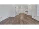 Open concept living and dining area featuring wood-style flooring and neutral walls at 4828 Marco Polo St, North Las Vegas, NV 89031