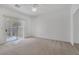 Spacious main bedroom with neutral carpet, large windows, and patio access at 4828 Marco Polo St, North Las Vegas, NV 89031