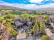 Expansive two-story home with tile roof, two-car garage, mature trees, and landscaping in picturesque, upscale community at 5 Via Ravenna Ct, Henderson, NV 89011