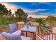 Enjoy the view from this cozy balcony setting with seating and a table for enjoying wine outdoors at 5 Via Ravenna Ct, Henderson, NV 89011