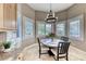 Bright breakfast nook with plantation shutters and views of the lush backyard at 5 Via Ravenna Ct, Henderson, NV 89011