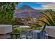 Beautiful community view featuring lush landscaping, serene water features, and stunning mountain scenery at 5 Via Ravenna Ct, Henderson, NV 89011