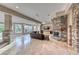 Spacious living room boasts a stone fireplace, travertine floors, and large windows at 5 Via Ravenna Ct, Henderson, NV 89011