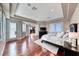 The main bedroom features dark hardwood floors, shuttered windows, and an attached sitting area at 5 Via Ravenna Ct, Henderson, NV 89011