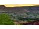 Scenic neighborhood view at sunset, with lush greenery and mountains in the background at 5 Via Ravenna Ct, Henderson, NV 89011