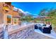 Impressive outdoor kitchen and dining area with built-in grill, perfect for entertaining and enjoying outdoor living at 5 Via Ravenna Ct, Henderson, NV 89011