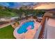 Inviting pool with a hot tub and ample seating area, perfect for outdoor relaxation and entertainment at 5 Via Ravenna Ct, Henderson, NV 89011