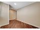 This bedroom features hardwood floors, base trim and neutral-toned walls at 516 Arizona St, Boulder City, NV 89005