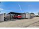 A large red truck parked in a covered carport on a sunny day at 516 Arizona St, Boulder City, NV 89005