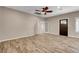 Inviting living room with wood-look flooring and a ceiling fan at 516 Arizona St, Boulder City, NV 89005