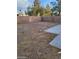 Large, empty backyard enclosed by a tall brick wall, ready for customization and landscaping projects at 5316 Clover Blossom Ct, North Las Vegas, NV 89031
