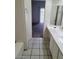 Bathroom featuring a vanity, tub, and view into another room at 5316 Clover Blossom Ct, North Las Vegas, NV 89031