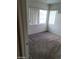 Bedroom with cozy carpet, bright windows, and a neutral color scheme at 5316 Clover Blossom Ct, North Las Vegas, NV 89031