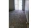 Cozy bedroom featuring a sliding glass door for access and carpet floors at 5316 Clover Blossom Ct, North Las Vegas, NV 89031