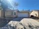 Charming single-story home with a well-maintained front yard and two car garage at 5316 Clover Blossom Ct, North Las Vegas, NV 89031