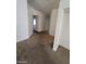 Bright hallway with neutral walls leads to different rooms at 5316 Clover Blossom Ct, North Las Vegas, NV 89031