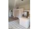 Spacious open-plan kitchen featuring tile flooring, stainless steel appliances, and a bright airy atmosphere at 5316 Clover Blossom Ct, North Las Vegas, NV 89031